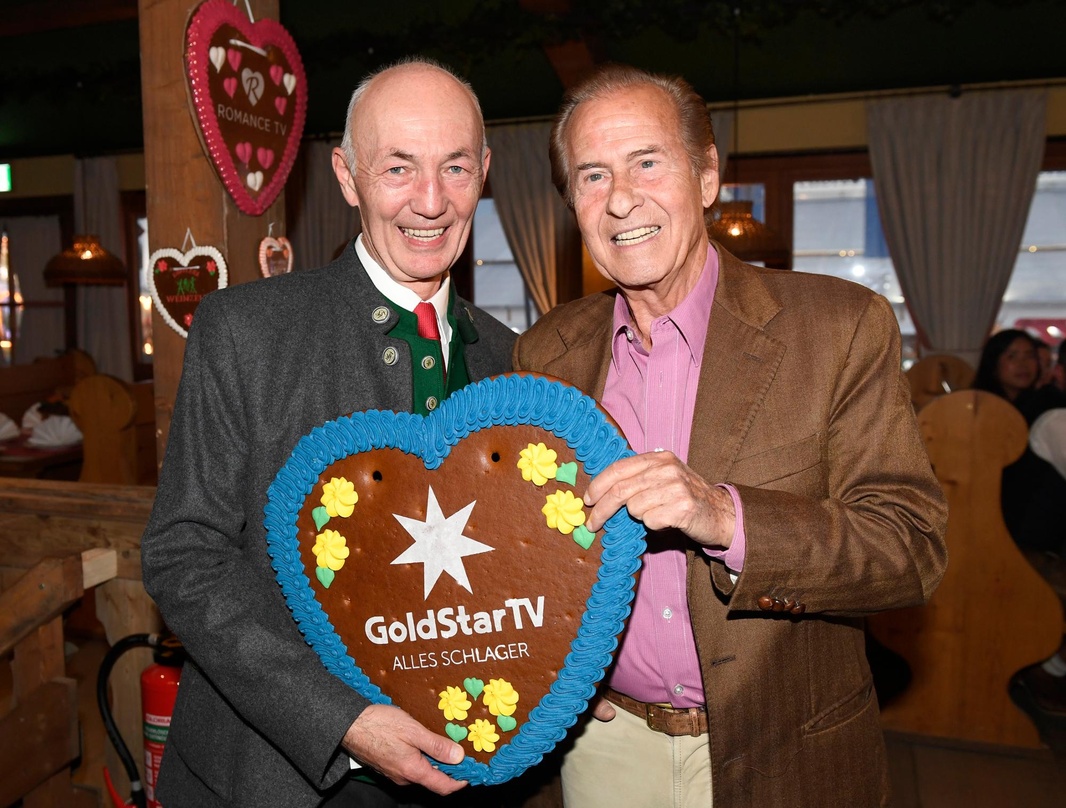 Feierten auf der Wiesn: Gottfried Zmeck (Vorstandsvorsitzender Mainstream Media AG) und Michael Holm